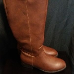 Zippered brown leather boots
